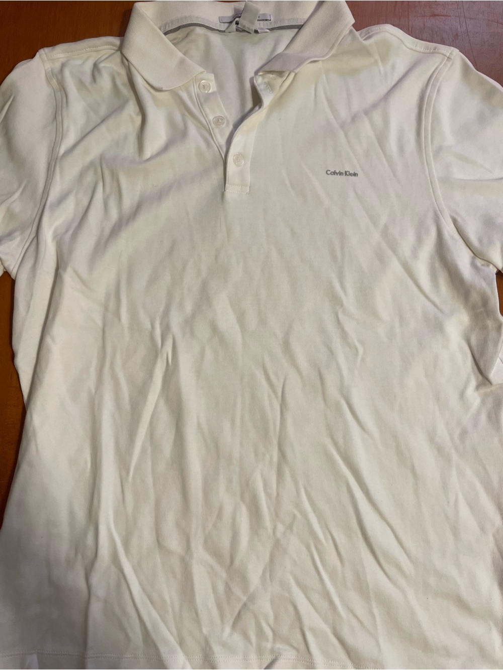 Calvin Klein Men's Cream Polo Shirt with Subtle Logo